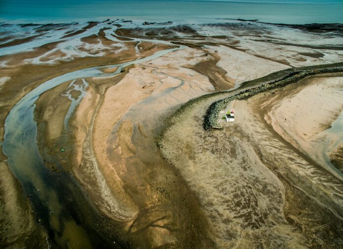 top view photography of house near body of water