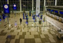 공항 입국 때 ‘이것’ 확인하세요…반입금지 물품 등 집중단속 a man is walking through an airport terminal