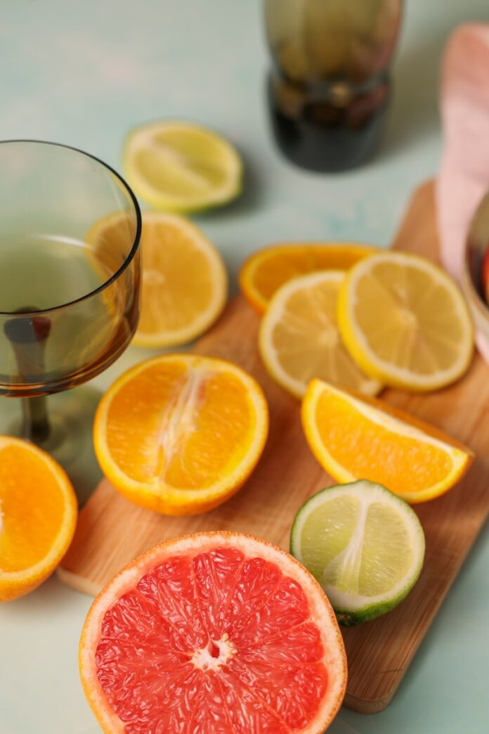 grapefruit, lime, and orange slices on a cutting board