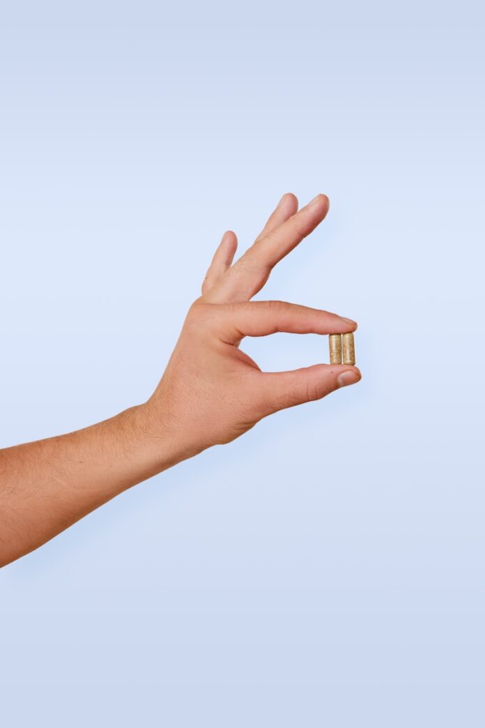 A person's hand with a ring on it